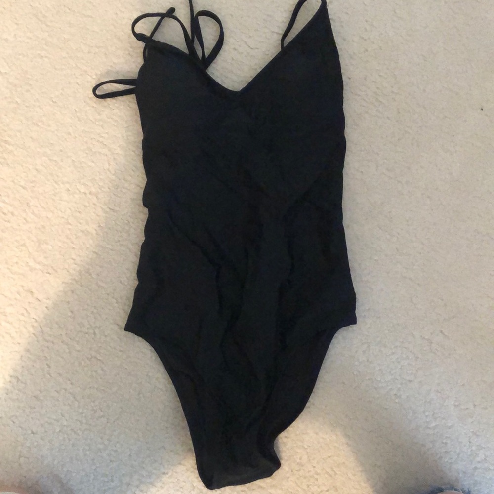 Black, open-backed Aerie one-piece